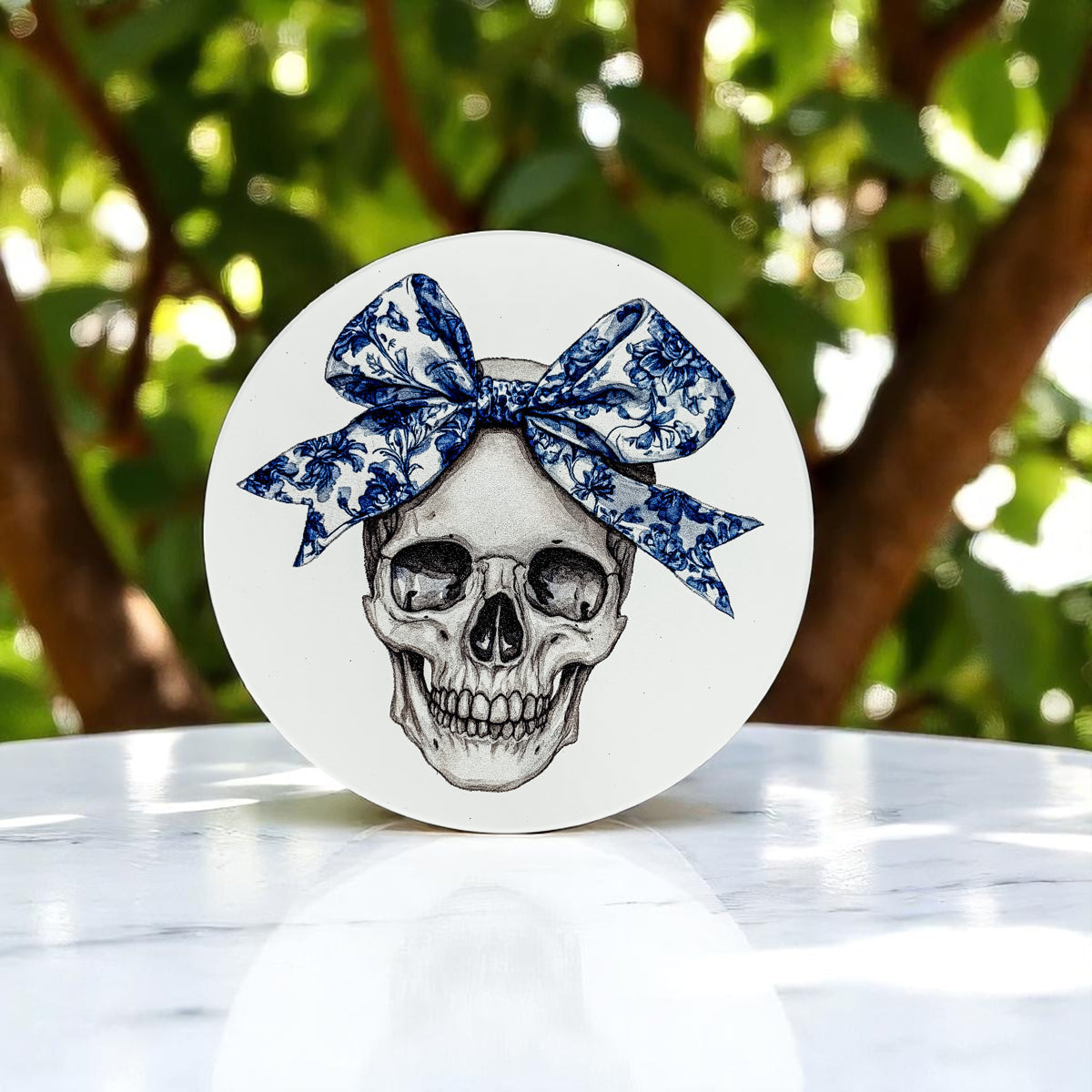 Halloween coasters styled with autumn leaves and pumpkins
Gothic blue willow coasters in modern Halloween tablescape
Bow skull Halloween coaster with delicate blue floral details
Blue chinoiserie pumpkin coaster with intricate pattern details
White pumpkin coaster with blue bow and floral chinoiserie design